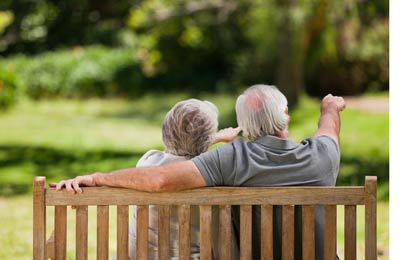 golden anniversary couple on bench